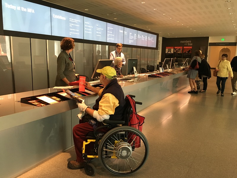 Man in wheelchair at museum.